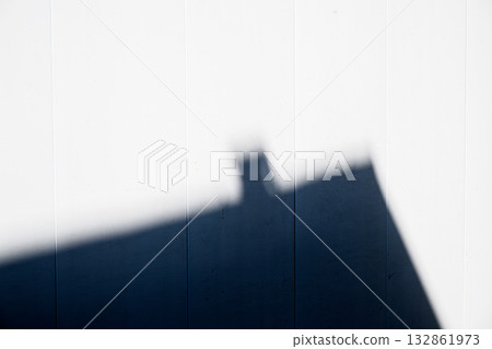 Abstract shadow of a building on a white wall 132861973