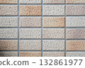 Beige tile wall with regular grid pattern texture 132861977