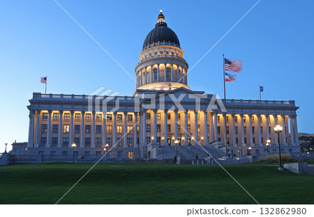 Utah State Capitol illuminated at dusk with green grass on the foreground 132862980