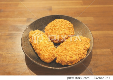 A delicious plate of crispy croquettes A delicious plate of crispy croquettes 132864065