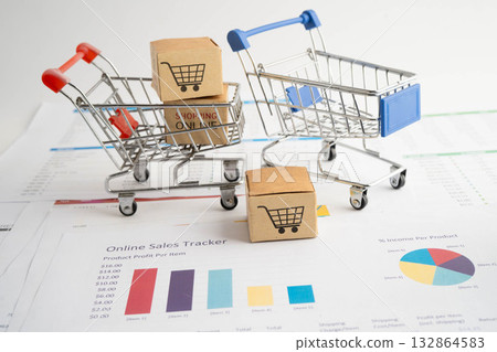 Online shopping, Shopping cart box on business graph, import export, finance commerce. Online shopping, Shopping cart box on business graph, import export, finance commerce. 132864583