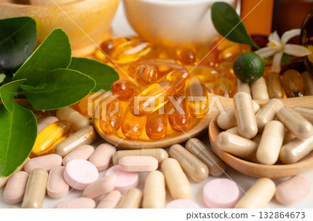 Alternative medicine herbal organic capsule with vitamin E omega 3 fish oil, mineral, drug with herbs leaf natural supplements for healthy good life. 132864673