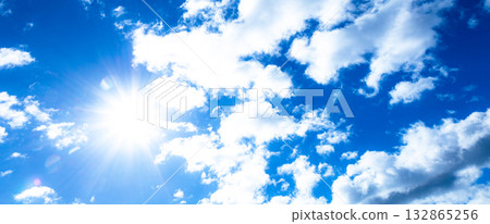 A simple landscape of blue sky, clouds and sun A simple landscape of blue sky, clouds and sun 132865256
