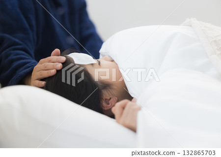 A mother and a girl with a fever A mother and a girl with a fever 132865703