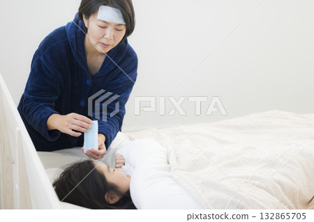 A mother and a girl with a fever 132865705