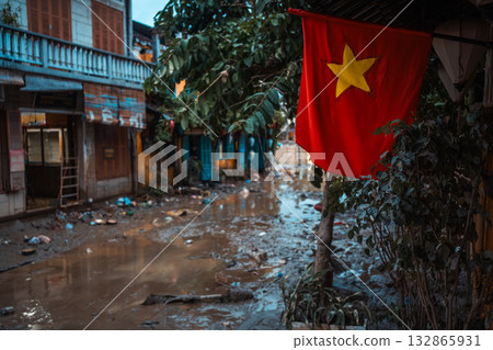 flooded city or town with buildings submerged in overflow water and mud, village underwater after heavy tropical rain and typhoon, consequences with dirt on the street flooded city or town with buildings submerged in overflow water and mud, village underwater after heavy tropical rain and typhoon, consequences with dirt on the street 132865931