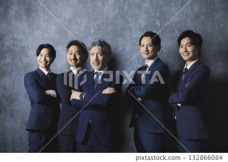 Men in suits standing side by side Men in suits standing side by side 132866084