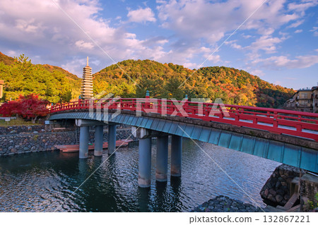 Red bridge cross Uji river to thirteen storied pagoda in fall, Kyoto 132867221