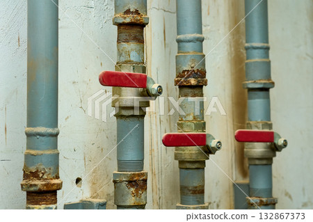 Plumbing contrlol.Water valve shutting off the water tap in basement Plumbing contrlol.Water valve shutting off the water tap in basement 132867373