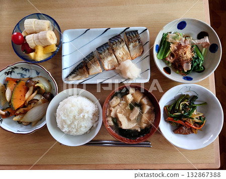 A set menu of grilled fish at a local Japanese restaurant (grilled salted mackerel, stir-fried liver and leek, a small plate of green vegetables, and a bowl of soup) A set menu of grilled fish at a local Japanese restaurant (grilled salted mackerel, stir-fried liver and leek, a small plate of green vegetables, and a bowl of soup) 132867388
