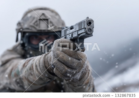 Soldier in winter gear aiming a pistol during training in a snowy landscape 132867835