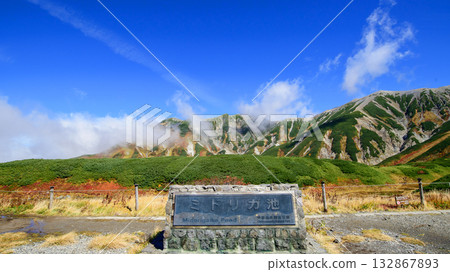Murododaira: Midorigaike Pond and the Tateyama Mountain Range in Autumn, Tateyama Kurobe Alpine Route, Toyama Prefecture Murododaira: Midorigaike Pond and the Tateyama Mountain Range in Autumn, Tateyama Kurobe Alpine Route, Toyama Prefecture 132867893