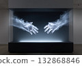 Longing abstract sculpture of hands reaching toward each other in a modern gallery setting 132868846