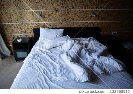 Messy Bed in a Bedroom Messy Bed in a Bedroom 132868915