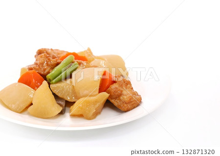 Boiled root vegetables: daikon radish, carrots, and fish cakes on a light background 132871320