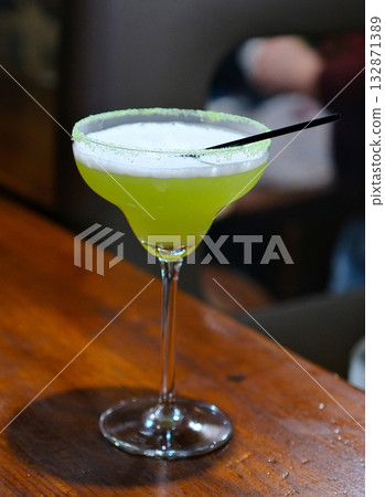 A glass with margarita cocktail with lime A glass with margarita cocktail with lime 132871389