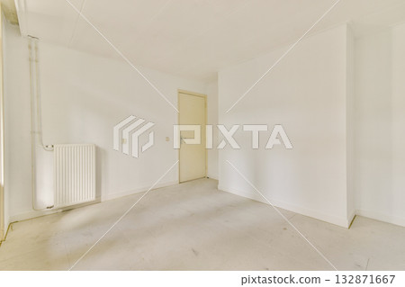A minimalistic and clean white interior showcasing an empty room with plain walls and flooring, emphasizing simplicity and spaciousness. A minimalistic and clean white interior showcasing an empty room with plain walls and flooring, emphasizing simplicity and spaciousness. 132871667