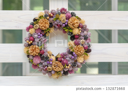Wreaths hanging on a wooden deck 132871668