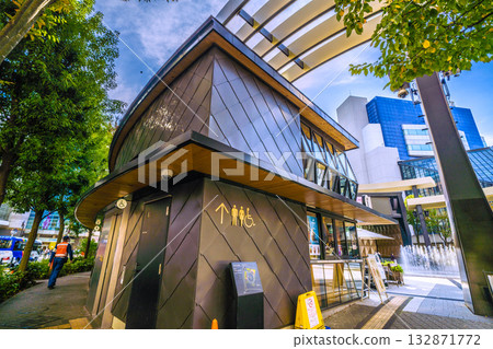 Tokyo cityscape in Japan: Ikebukuro West Exit Park in front of Ikebukuro Station, Global Ring, cafes, and toilets. Security cameras are also there... = 7th Tokyo cityscape in Japan: Ikebukuro West Exit Park in front of Ikebukuro Station, Global Ring, cafes, and toilets. Security cameras are also there... = 7th 132871772