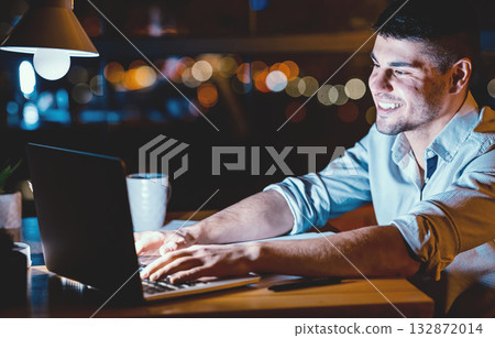 Happy Businessman Working On Laptop Browsing Internet Sitting At Workplace In Office At Night. Corporate Lifestyle 132872014