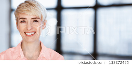 Portrait Of Happy Businesswoman Smiling Looking At Camera Posing In Modern Office. Successful Business People. Selective Focus Portrait Of Happy Businesswoman Smiling Looking At Camera Posing In Modern Office. Successful Business People. Selective Focus 132872455