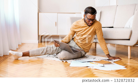 African American Student Using Laptop Studying Or Working On Project Sitting On Floor At Home. Selective Focus 132872832