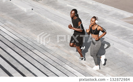 Black Man And Woman Jogging Together In Urban Park, Running Up Steps, Working Out Outdoors, Empty Space 132872984