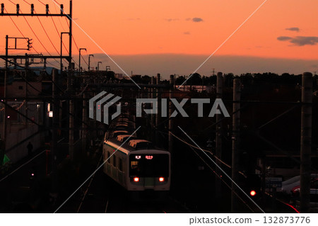 The Kokubunji Line in late autumn with a beautiful sunset sky 132873776
