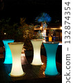 A stylish, luminous bar stand table 132874354