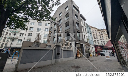 A wall with sculpture at the shopping street in Antwerp A wall with sculpture at the shopping street in Antwerp 132875201