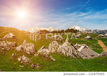 Mountain village in Alps, wooden houses in traditional style, Velika Planina, Kamnik, Slovenia Mountain village in Alps, wooden houses in traditional style, Velika Planina, Kamnik, Slovenia 132875403