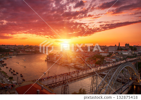 Scenic view of Porto city during sunset with a bridge over the river in Portugal. 132875418