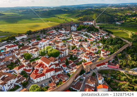 Aerial view of Obidos with historic walls and castle, Leiria district, Portugal Aerial view of Obidos with historic walls and castle, Leiria district, Portugal 132875424