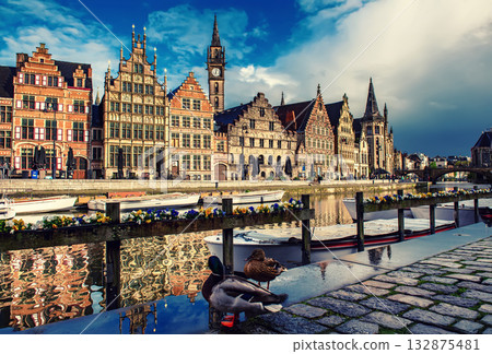 Ghent city historical center, tourists boats and colorful buildings on Leie river bank, Belgium Ghent city historical center, tourists boats and colorful buildings on Leie river bank, Belgium 132875481