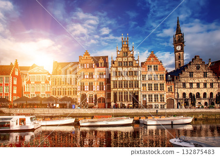 Ghent city historical center, tourists boats and colorful buildings on Leie river bank, Belgium 132875483