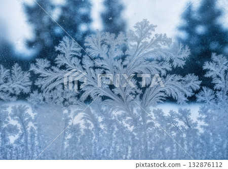 Delicate Frost Patterns on Windowpane Close-up with Backlit Ice Crystal Details and Winter Scene Delicate Frost Patterns on Windowpane Close-up with Backlit Ice Crystal Details and Winter Scene 132876112