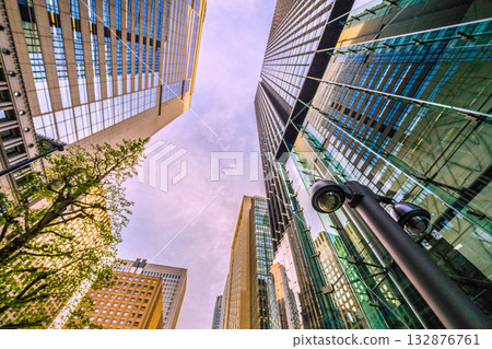 Tokyo cityscape in Japan: Security cameras on a street corner in Otemachi. Near the Otemachi Station intersection, an "eye" watches over commuters. Tokyo cityscape in Japan: Security cameras on a street corner in Otemachi. Near the Otemachi Station intersection, an "eye" watches over commuters. 132876761