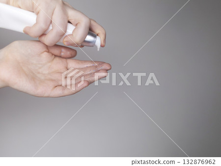 Microplastics in cosmetics. A woman applied a care cream to her skin, now it is covered with plastic particles and microbeads. Cosmetics toxicity concept Microplastics in cosmetics. A woman applied a care cream to her skin, now it is covered with plastic particles and microbeads. Cosmetics toxicity concept 132876962