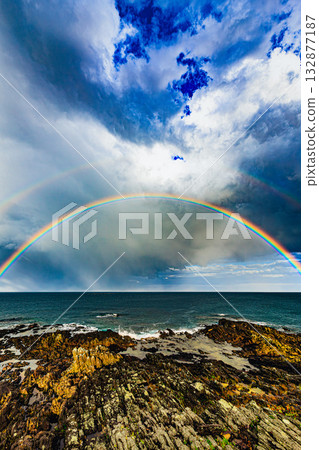 Coastal scenery colored by dramatic skies and rainbows Coastal scenery colored by dramatic skies and rainbows 132877187