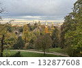 Autumn scenery in the Parc des Buttes Chaumont in the 19th arrondissement in northeastern Paris, with the Suicide Bridge spanning Belvedere Island 132877608