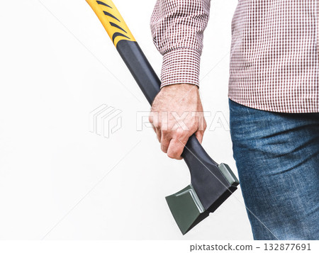 Handsome man, work clothes and axe. Studio shot. 132877691