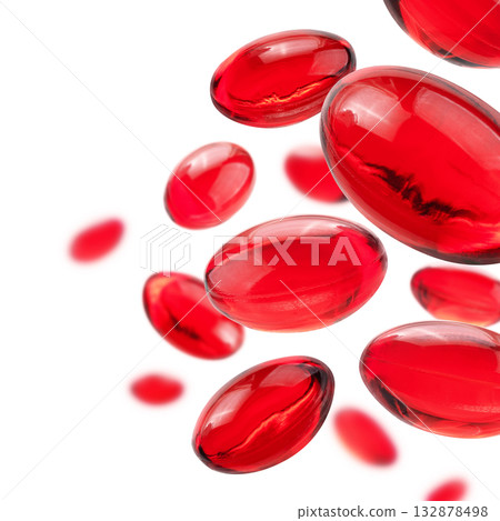Red capsules levitate on a white background 132878498