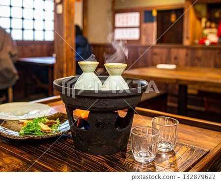 Warm hot sake Warm hot sake 132879622