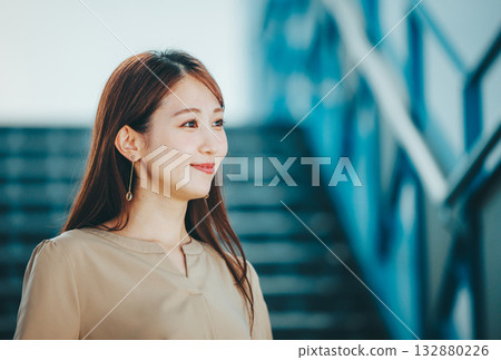 Portrait of a woman going down the stairs 132880226