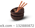 Stack of Natural Coconut Shell Bowls With Wooden Spoons 132880872