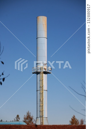 Industrial Water Tower Pipeline Against Blue Sky 132880917