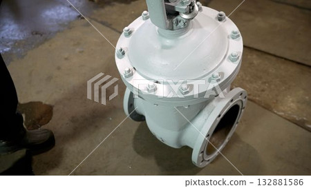 Industrial gate valve awaiting installation in factory Industrial gate valve awaiting installation in factory 132881586