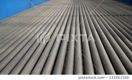 Close-up view of steel pipes at a metallurgical plant. Heat pipe production. 132881588