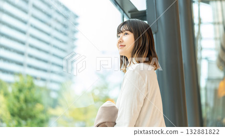 Woman looking out the window Woman looking out the window 132881822