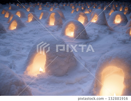A fantastical scene of candles lit in a small snow hut A fantastical scene of candles lit in a small snow hut 132881916